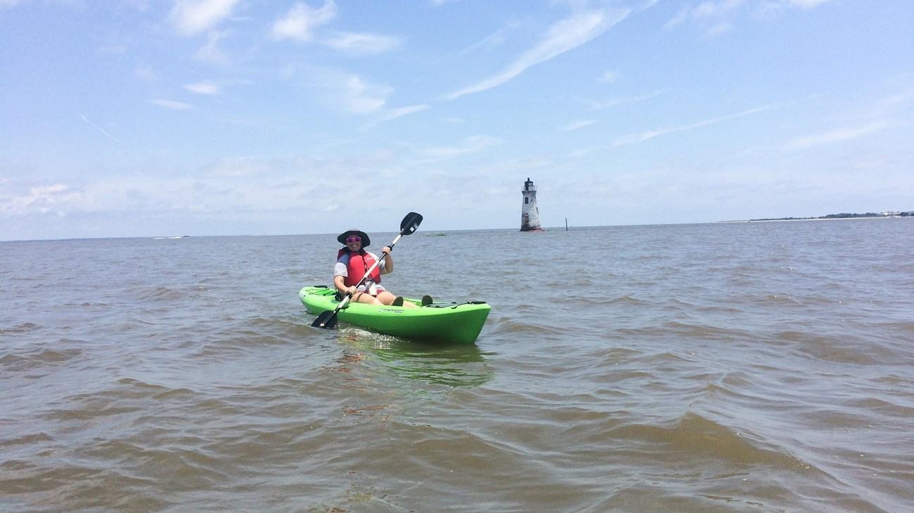 NPS/J. Cadoff, kayak near Cockspur Island Lighthouse