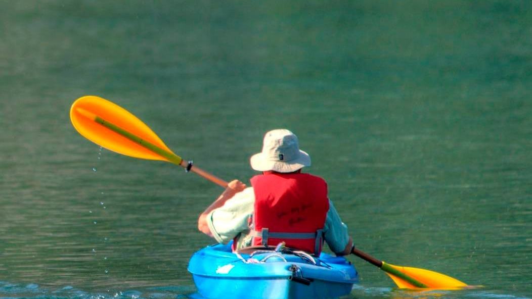 U.S. National Park Service / North Cascades, two paddlers on a mountain lake