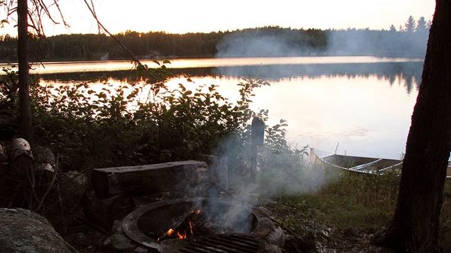 National Park Service — canoe beside the water at Peary Lake | Voyageurs Backcountry by Canoe: The Two-Stage Journey to a Remote Lake