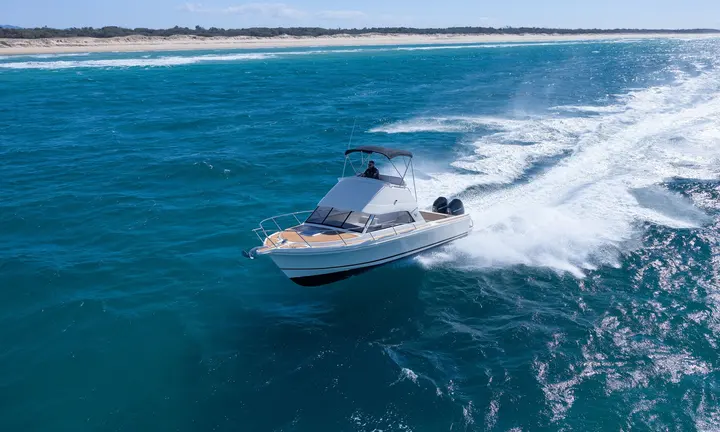 Caribbean Boats official photograph of the 27F flybridge underway | Caribbean Shows Revived 40F and 27F Flybridge Boats in Melbourne
