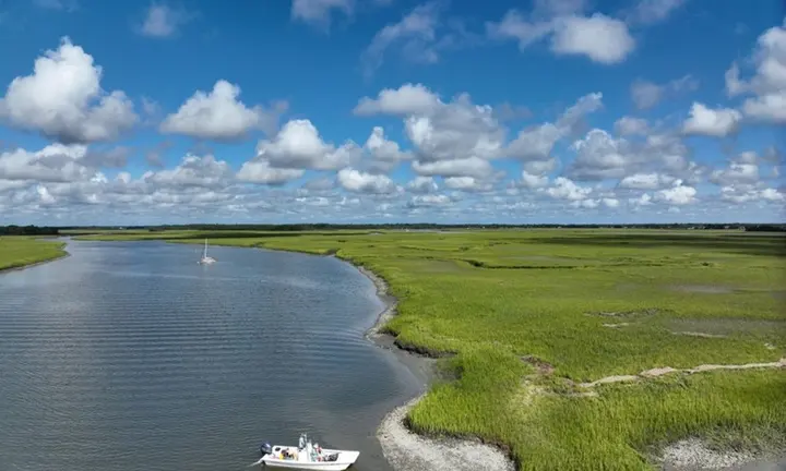 NOAA NCCOS / Brandon Puckett — aerial view of oyster reefs in Folly River, South Carolina