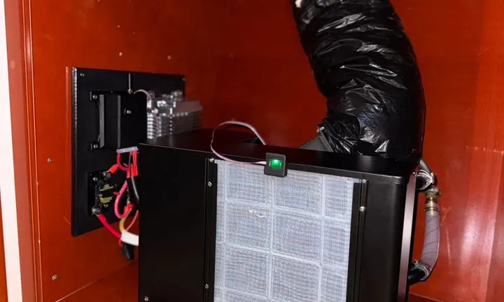 SeaAir official photograph: installed climate-control equipment in a yacht cabinet