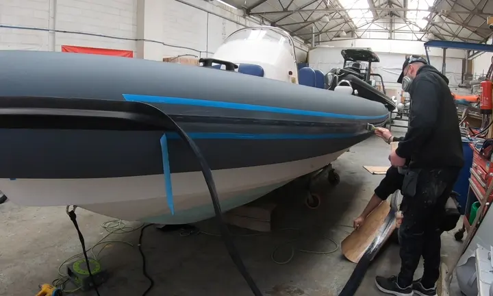MDL Marinas — official photograph of a RIB in the tube-replacement workshop
